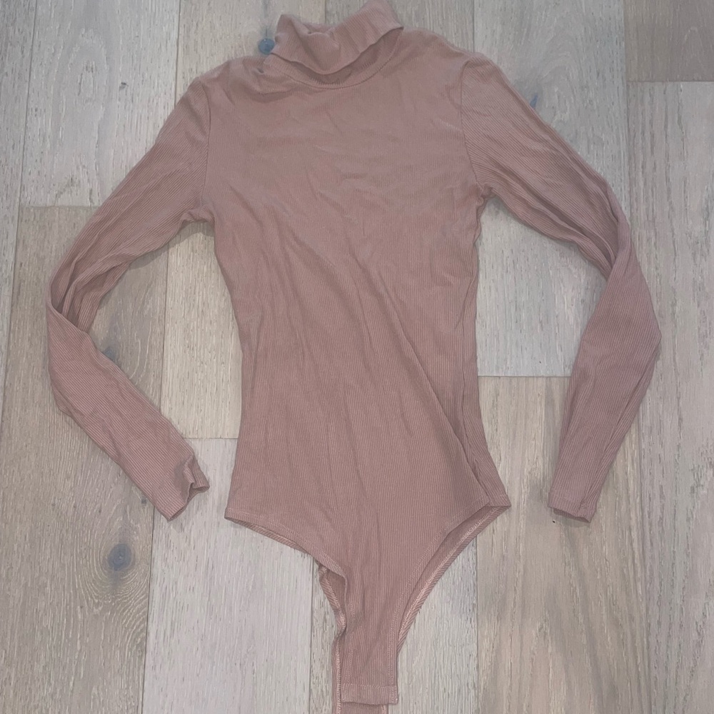 Tan turtleneck bodysuit